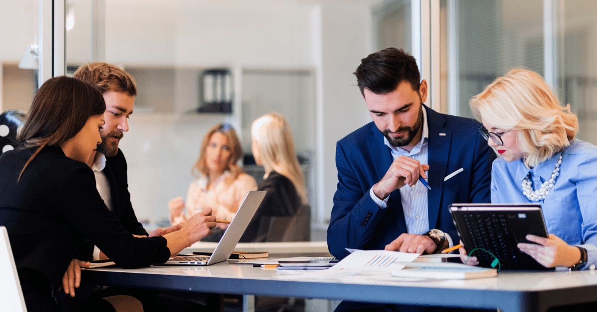 Group of coworkers discusses plan to improve email deliverability