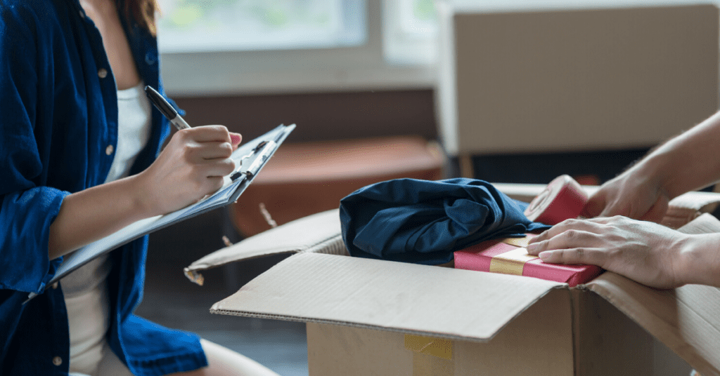 Two people packing for a move