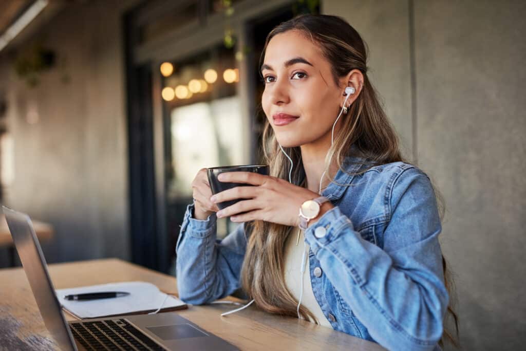 woman listening to podcast about volunteering and mentoring