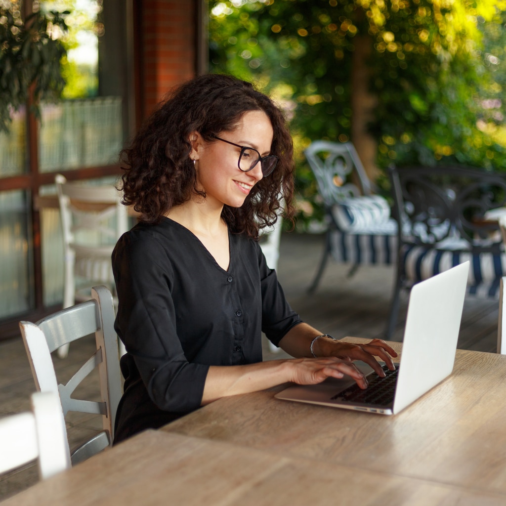 woman exploring resources on her association's online community