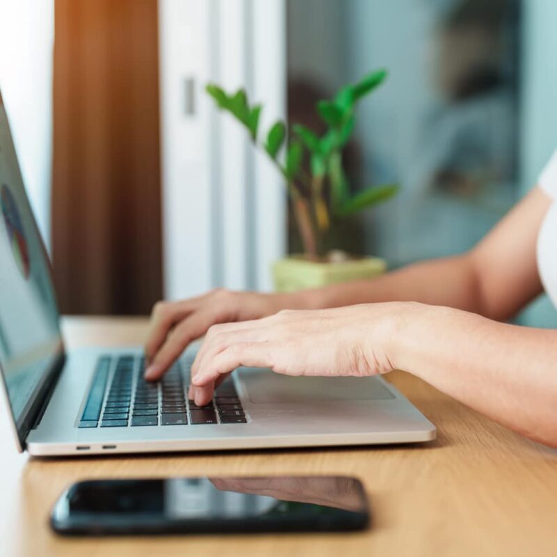 Person using laptop to look up email opt-in methods