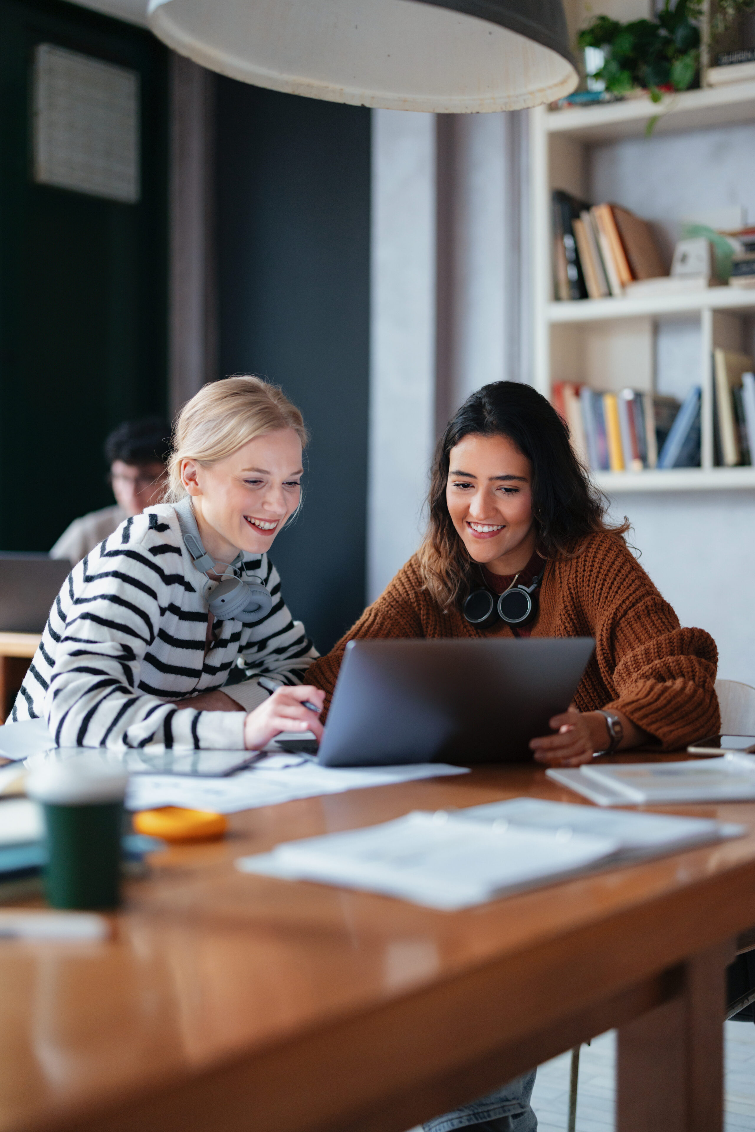two association professionals looking up language and keywords in an online community to improve member engagement